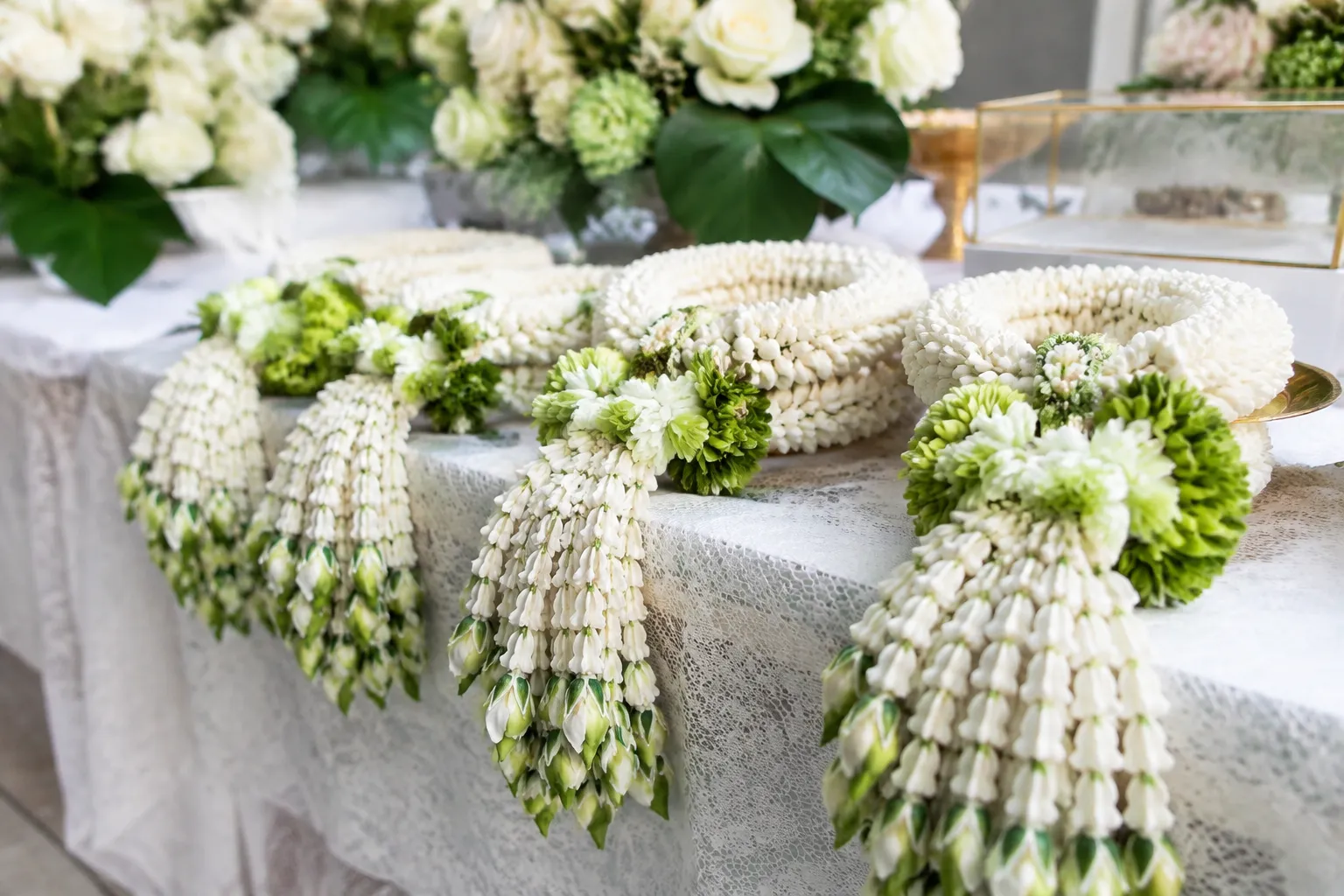 Thai wedding flower garlands arranged for a ceremony table